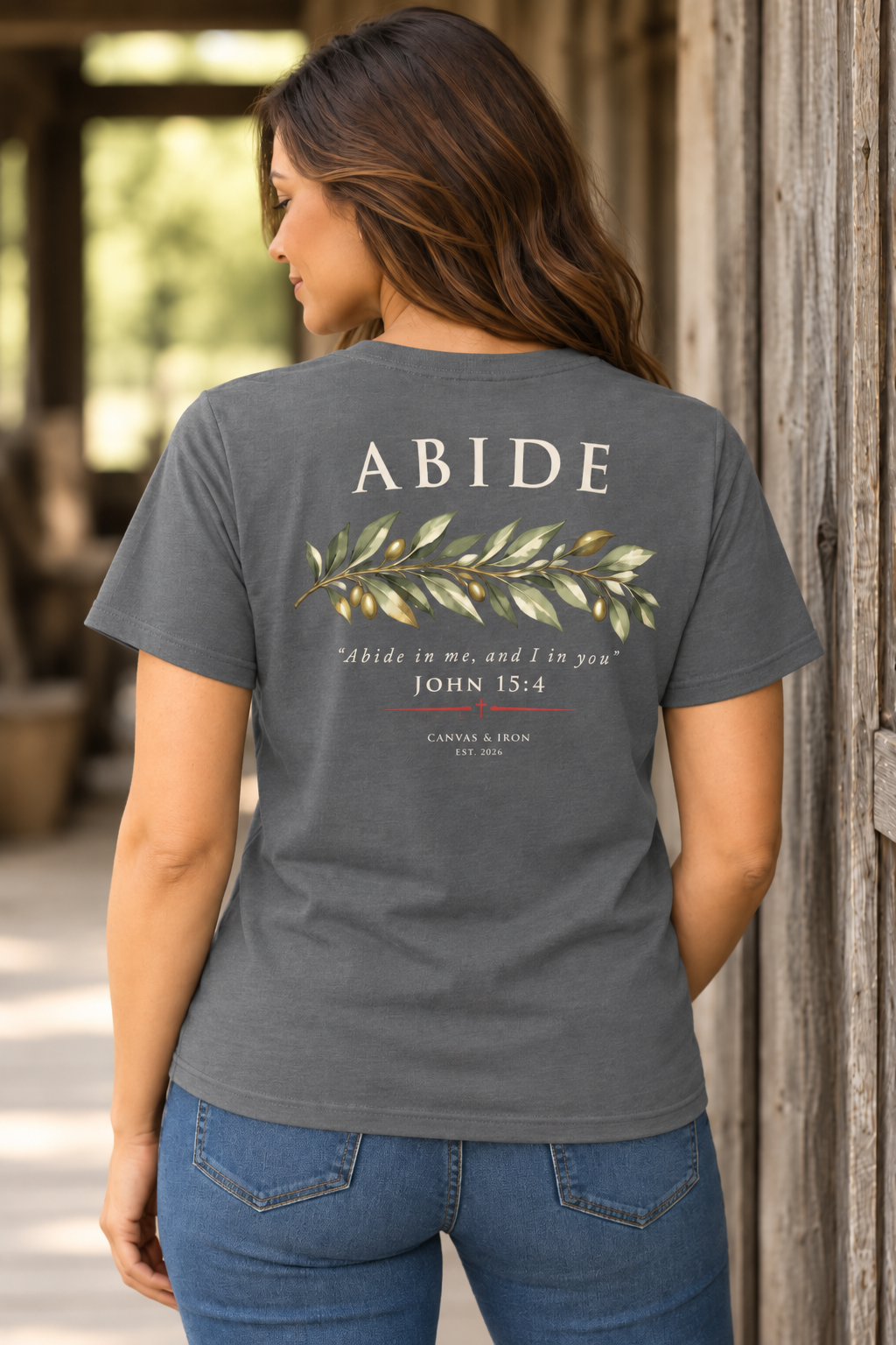 Back of gray Abide faith tee with olive branch artwork and John 15:4 scripture