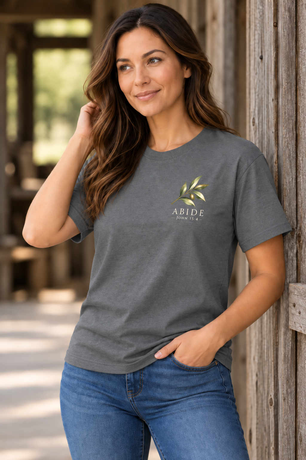 Close-up of Abide John 15:4 olive branch chest graphic on gray shirt