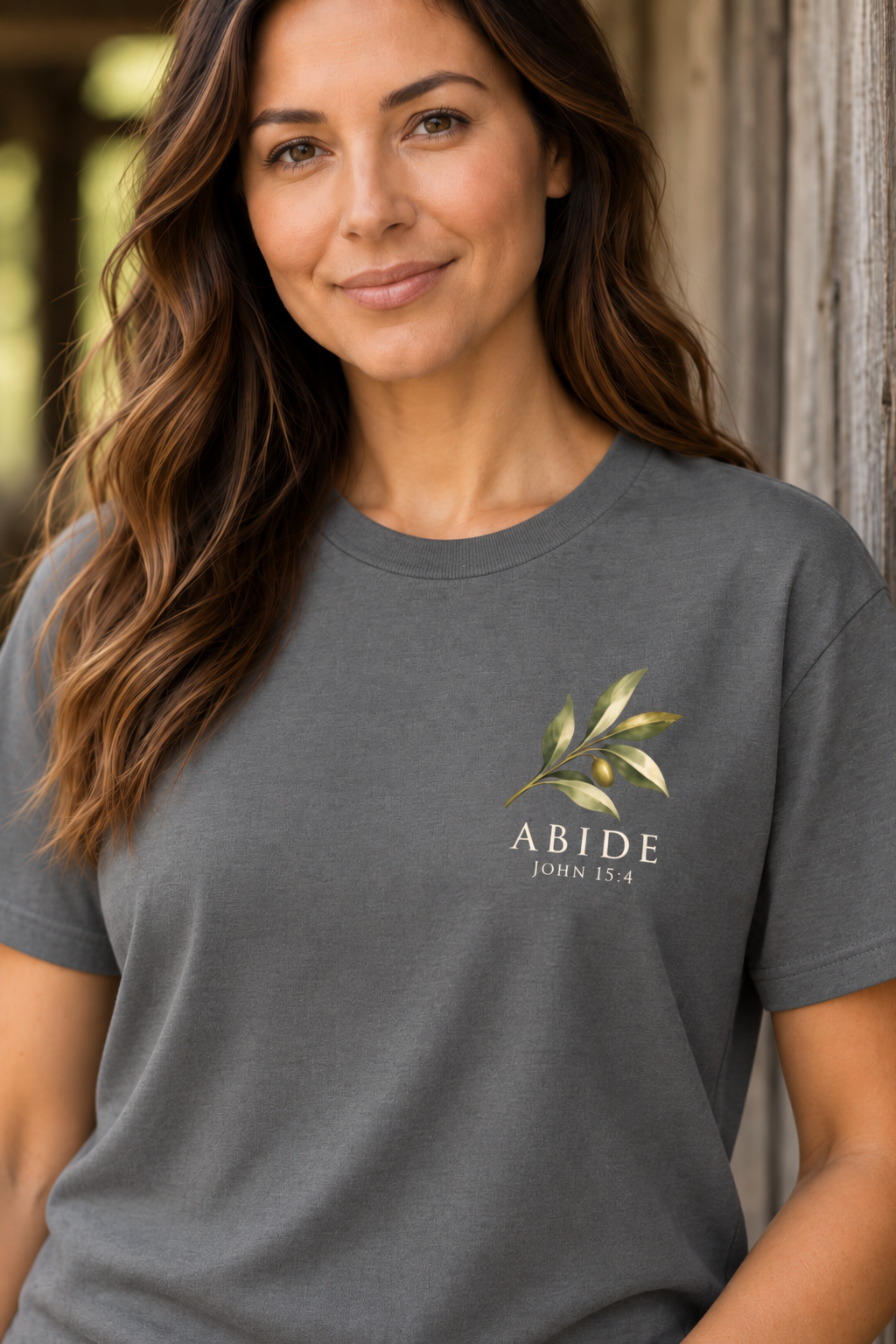 Gray Abide Christian women’s tee with small olive branch chest print