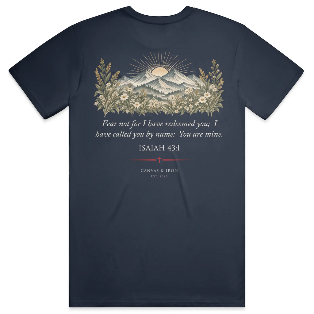 Back of Redeemed women’s faith tee with Isaiah 43:1 mountain and wildflower artwork