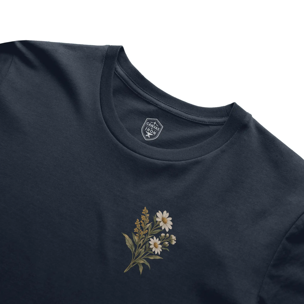 Redeemed women’s Christian faith tee in navy with floral chest artwork
