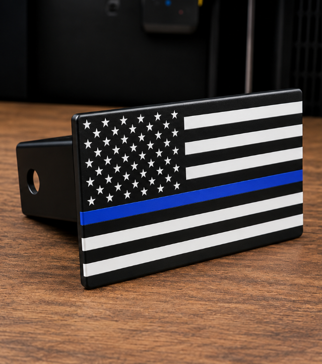 The Thin Blue Line hitch cover sitting on a table top