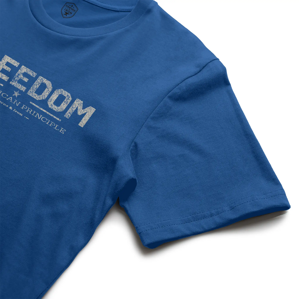 [Royal Blue] Canvas & Iron Freedom Essential royal blue T-shirt angled view showing front Freedom graphic